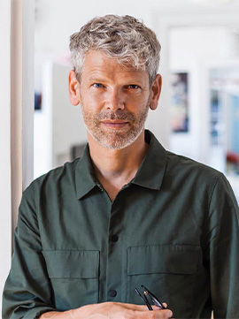 portrait-of-mature-man-with-grey-hair-and-stubble-2022-12-16-22-37-27-utc-1